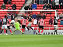 Tom Hopper scores the crucial goal for Lincoln City