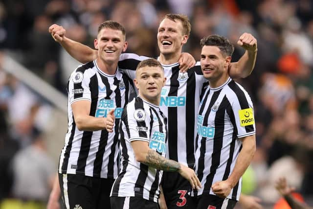 Sven Botman, Kieran Trippier, Dan Burn and Fabian Schar of Newcastle United celebrate their side's win after the final whistle of the Premier League match between Newcastle United and Everton FC at St. James Park on October 19, 2022 in Newcastle upon Tyne, England. (Photo by George Wood/Getty Images)