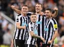 Sven Botman, Kieran Trippier, Dan Burn and Fabian Schar of Newcastle United celebrate their side's win after the final whistle of the Premier League match between Newcastle United and Everton FC at St. James Park on October 19, 2022 in Newcastle upon Tyne, England. (Photo by George Wood/Getty Images)