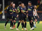 Fabian Schar of Newcastle United celebrates with team mates Dwight Gayle, Joe Willock and Jacob Murphy after scoring his team's second goal during the Premier League match between Fulham and Newcastle United at Craven Cottage on May 23, 2021 in London, England.
