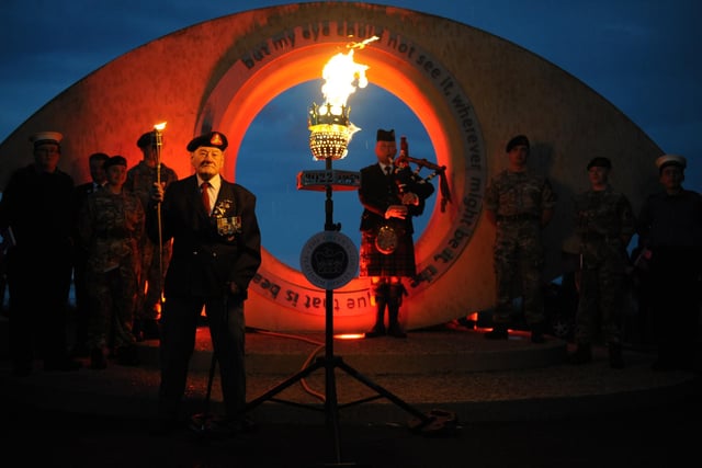 Veteran Joe Smith Bailes lights the first of two beacons in South Shields.