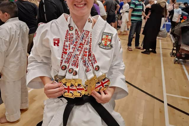 Dokan's Elle Smith with her medal haul.