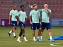 Brazil's forward Vinicius Junior (2nd L), Brazil's midfielder Bruno Guimaraes (C) and Brazil's forward Pedro (R) take part in a training session at Al Arabi SC stadium in Doha on November 23, 2022, on the eve of the Qatar 2022 World Cup football match between Brazil and Serbia. (Photo by NELSON ALMEIDA/AFP via Getty Images)