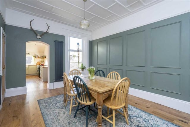 Dining room with feature panelled wall.