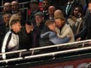 Newcastle United head coach Eddie Howe is greeted by co-owner Amanda Staveley and chairman Yasir Al-Rumayyan after the game.