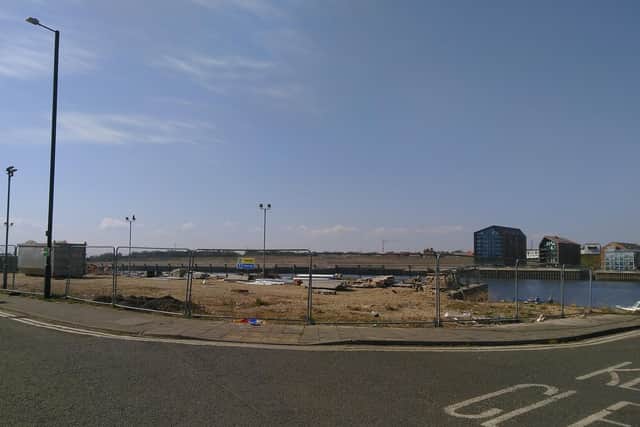 The site is currently caged-off and unused
