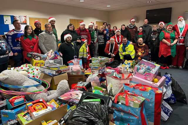 Classic car enthusiasts drop donations of at Stockton Salvation Army