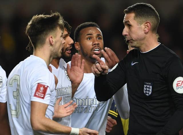Arsenal's Kieran Tierney,  Mo Elneny and Gabriel appeal to referee David Coote during the Emirates FA Cup Third Round match between Oxford United and Arsenal at Kassam Stadium on January 09, 2023 in Oxford, England. (Photo by Stuart MacFarlane/Arsenal FC via Getty Images)