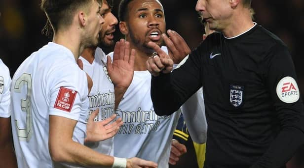 Arsenal's Kieran Tierney,  Mo Elneny and Gabriel appeal to referee David Coote during the Emirates FA Cup Third Round match between Oxford United and Arsenal at Kassam Stadium on January 09, 2023 in Oxford, England. (Photo by Stuart MacFarlane/Arsenal FC via Getty Images)
