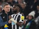 Newcastle United head coach Eddie Howe speaks with winger Allan Saint-Maximin during the West Ham United game.