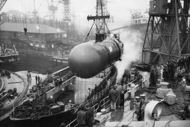 Picture from November 1963. One of the two 50-ton pressure cargo tanks being fitted into the 535-ton motor vessel Broughty as part of its conversion into a liquid gas carrier at Hawthorn Leslie (Shipbuilders) Ltd., Hebburn. being lifted aboard the ship by the floating crane Titan II.