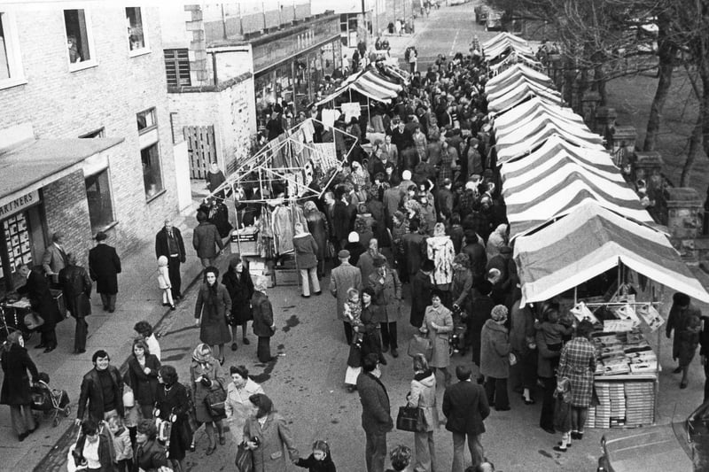 A cold day in March 1973 but these customers didn't mind the weather as they browsed through the stalls.