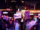 People shout slogans and hold placards, on June 1, 2020, in downtown Las Vegas, as they take part in a "Black lives matter" rally in response to the recent death of George Floyd, an unarmed black man who died while in police custody.