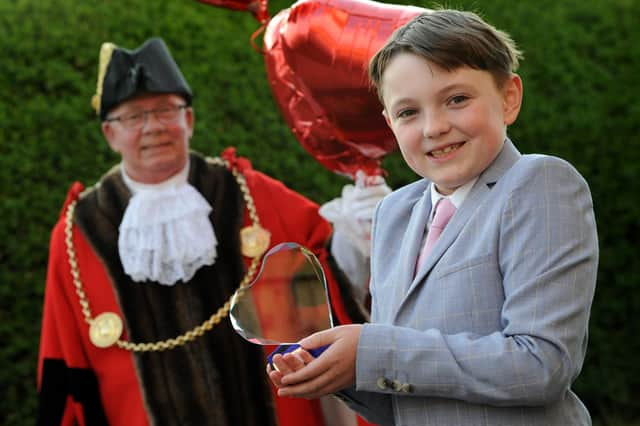 #LoveSouthTyneside winner 9-year-old Oliver Nicholson receives his award from the Mayor Cllr Norman Dick and Mayoress Mrs Jean Williamson.