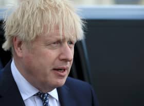 Boris Johnson reacts as he greets members of the public while campaigning on behalf of Conservative Party candidate Jill Mortimer (unseen) ahead of the 2021 Hartlepool by-election to be held on May 6 on May 3, 2021 in Hartlepool, north-east England. (Photo by Lindsey Parnaby - WPA Pool/Getty Images)