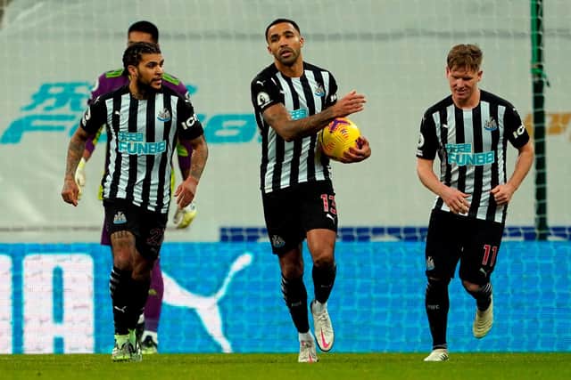 Newcastle United's English striker Callum Wilson (C) celebrates scoring a penalty during the English Premier League football match between Newcastle United and Fulham at St James' Park in Newcastle-upon-Tyne, north east England on December 19, 2020.
