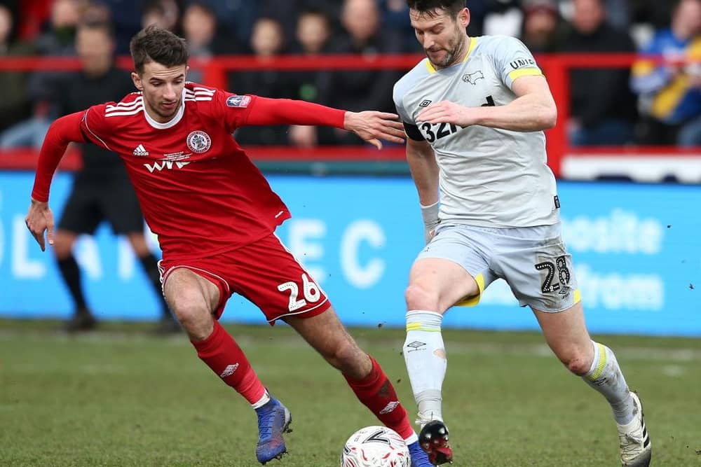 ACCRINGTON, ENGLAND - JANUARY 26:  David Nugent of Derby County runs with the ball under pressure from Dan Barlaser of Accrington Stanley during the FA Cup Fourth Round match between Accrington Stanley and Derby County at Wham Stadium on January 26, 2019 in Accrington, United Kingdom.  (Photo by Jan Kruger/Getty Images)