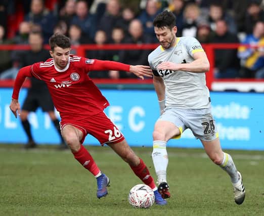 ACCRINGTON, ENGLAND - JANUARY 26: David Nugent of Derby County runs with the ball under pressure from Dan Barlaser of Accrington Stanley during the FA Cup Fourth Round match between Accrington Stanley and Derby County at Wham Stadium on January 26, 2019 in Accrington, United Kingdom. (Photo by Jan Kruger/Getty Images)