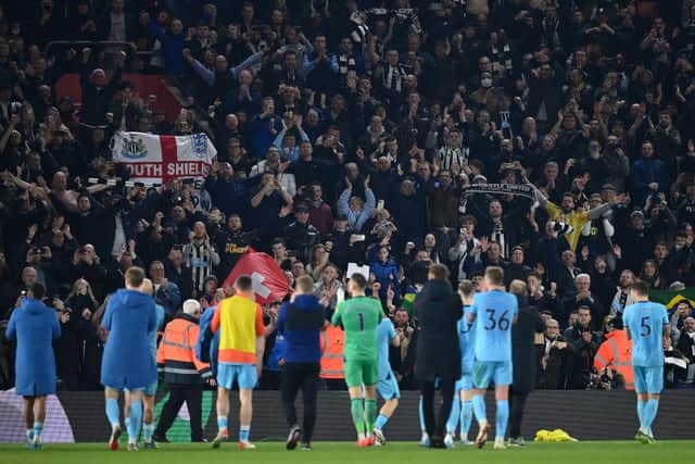 Newcastle United celebrate with their fans after the final whistle of the Premier League match between Southampton and Newcastle United at St Mary's Stadium on March 10, 2022 in Southampton, England.  (Photo by Dan Mullan/Getty Images)