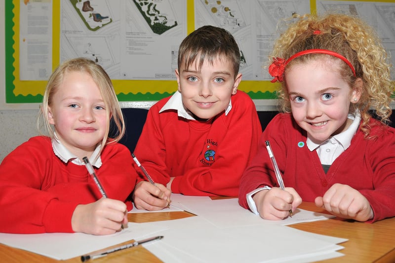 Rossmere Primary School pupils (left to right) Emma Harman, Curtis Reece Rowledge and Neeve Jessop write down the lyrics to their song. Can anyone tell us more about this 2013 event?