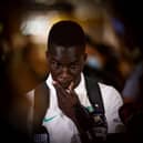 Newcastle United forward Garang Kuol talks to the media in Sydney, Australia last month after returning from the World Cup.