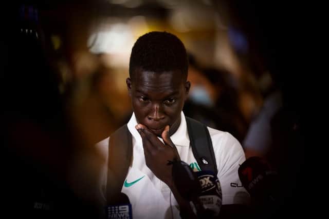 Newcastle United forward Garang Kuol talks to the media in Sydney, Australia last month after returning from the World Cup.