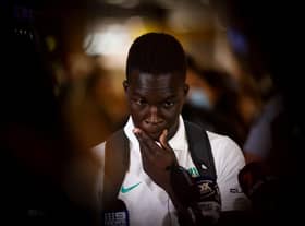 Newcastle United forward Garang Kuol talks to the media in Sydney, Australia last month after returning from the World Cup.