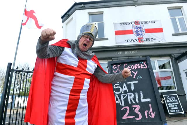 Dougie's Tavern manager Norman Scott gets ready for St George's Day.