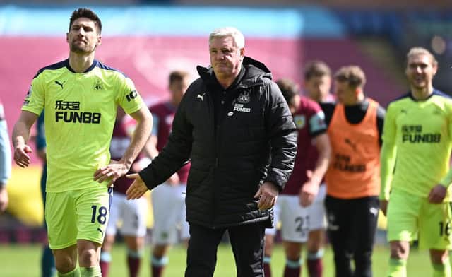 Federico Fernandez of Newcastle is congratulated by Manager Steve Bruce after the Premier League match between Burnley and Newcastle United at Turf Moor on April 11, 2021 in Burnley, England.