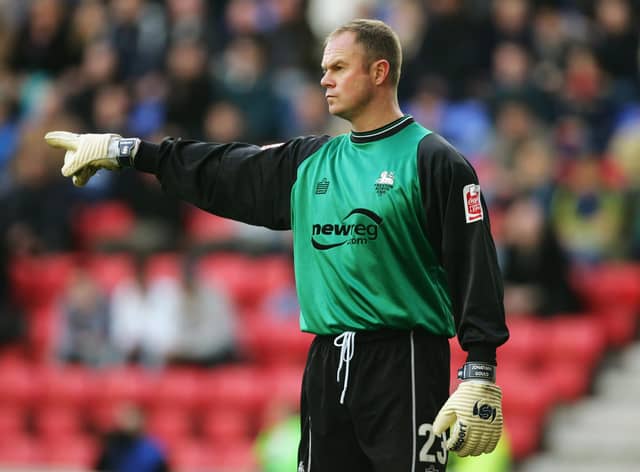 WIGAN, ENGLAND - DECEMBER 5:  Jonathan Gould of Preston North End in action during the Coca Cola Championship match between Wigan Athletic and Preston North End at the JJB Stadium on December 5, 2004 in Wigan, England.  (Photo by Alex Livesey/Getty Images)