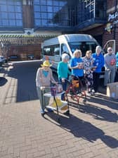 Residents Irene Pringle, Carole Crate, Bernadette Miller and Alan Hermiston from the care home alongside Erica Stott, Wellbeing Coordinator at HC-One’s Ashington Grange visiting the Daft as a Brush Cancer Patient Care Head Office to drop off an Easter egg donation
