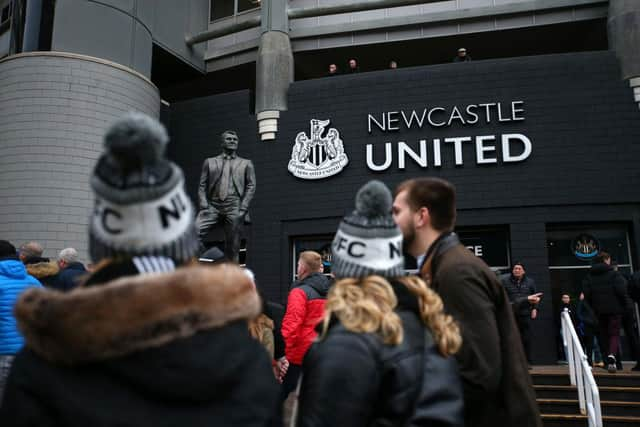 Fans outside St James's Park last season.