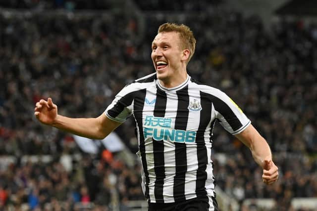 Dan Burn of Newcastle United celebrates after scoring their team's first goal during the Carabao Cup Quarter Final match between Newcastle United and Leicester City at St James' Park on January 10, 2023 in Newcastle upon Tyne, England. (Photo by Stu Forster/Getty Images)