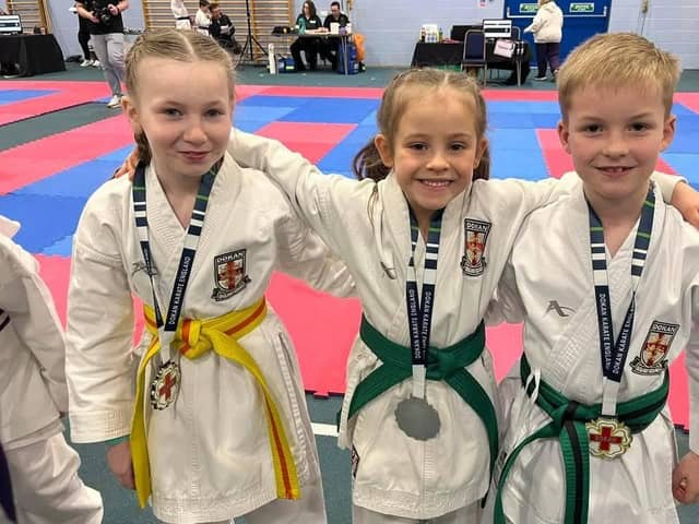 Medal winners Lucia Henderson, Charlotte Batey  and Leon Wilkinson.