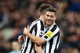 Newcastle United's Fabian Schar embraces team-mate Sean Longstaff after the Wolverhampton Wanderers win last weekend.