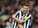 Newcastle United's Fabian Schar embraces team-mate Sean Longstaff after the Wolverhampton Wanderers win last weekend.