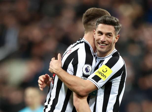 Newcastle United's Fabian Schar embraces team-mate Sean Longstaff after the Wolverhampton Wanderers win last weekend.