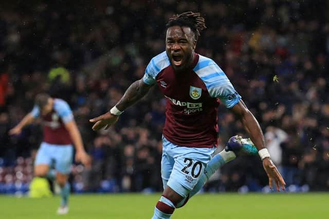 Burnley's Ivorian defender Maxwel Cornet celebrates after scoring there third goal during the English Premier League football match between Burnley and Everton at Turf Moor in Burnley, north west England on April 6, 2022.(Photo by LINDSEY PARNABY/AFP via Getty Images)