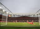 Pierre-Emerick Aubameyang of Arsenal scores their team's first goal past Illan Meslier of Leeds United. (Photo by Adam Davy - Pool/Getty Images)