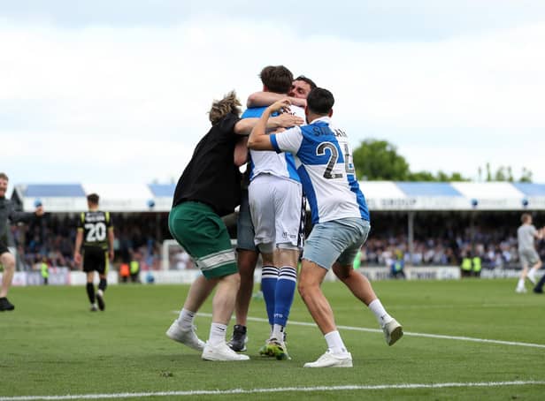 Bristol Rovers fans swarm Anthony Evans following his side's seventh goal during the Sky Bet League Two match at the Memorial Stadium, Bristol. Picture date: Saturday May 7, 2022.