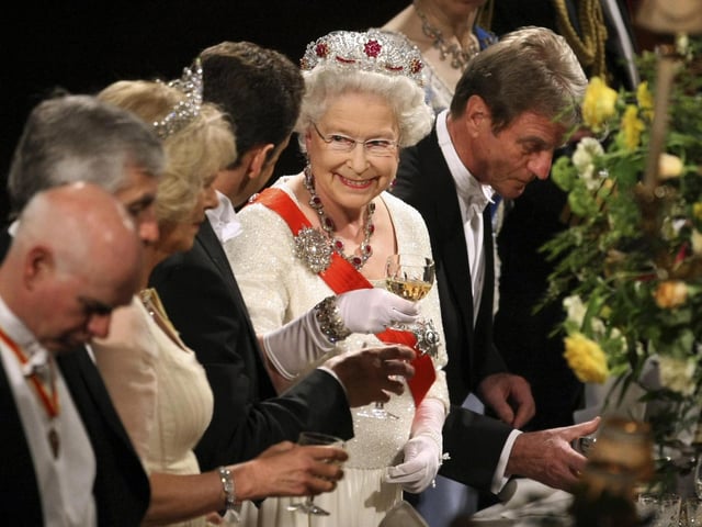 Queen Elizabeth II, toasting with France's then President Nicolas Sarkozy at the start of a state banquet at Windsor Castle in Windsor. 26/03/08