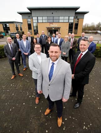 Castle's technical director, Simon Groom, managing director, Andrew Dawson and CEO, Tony Lister, with members of the senior management team.