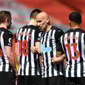 Sean Longstaff, Federico Fernandez, Jonjo Shelvey and Callum Wilson of Newcastle United line up in the wall for a free kick during the Premier League match between Liverpool and Newcastle United at Anfield on April 24, 2021 in Liverpool, England.
