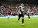 Callum Wilson of Newcastle United celebrates after scoring their side's first goal during the Premier League match between Newcastle United and Aston Villa at St. James Park on October 29, 2022 in Newcastle upon Tyne, England. (Photo by Nigel Roddis/Getty Images)