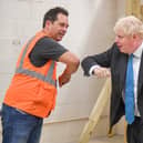 Prime Minister Boris Johnson meets students during a visit to Exeter College earlier today - he was also asked about the new rule for the North East, banning households from mixing in "any setting" but confusion remains. Photo by PA.
