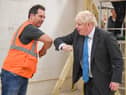 Prime Minister Boris Johnson meets students during a visit to Exeter College earlier today - he was also asked about the new rule for the North East, banning households from mixing in "any setting" but confusion remains. Photo by PA.