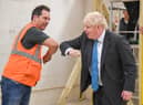 Prime Minister Boris Johnson meets students during a visit to Exeter College earlier today - he was also asked about the new rule for the North East, banning households from mixing in "any setting" but confusion remains. Photo by PA.
