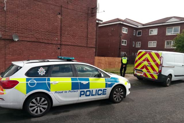 Northumbria Police remains on the scene in Victoria Road, South Shields, one day on from a man's body being discovered in a property there.