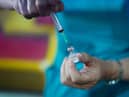 A doctor draws up the Pfizer-BioNTech vaccine at a pop-up vaccination centre. Picture: Ian Forsyth/Getty Images.