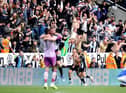 Bruno Guimaraes celebrates with Joelinton of Newcastle United after scoring their team's second goal during the Premier League match between Newcastle United and Leicester City at St. James Park on April 17, 2022 in Newcastle upon Tyne, England. (Photo by George Wood/Getty Images)